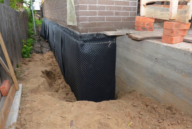 Happy homeowners after waterproofing job in Brandon